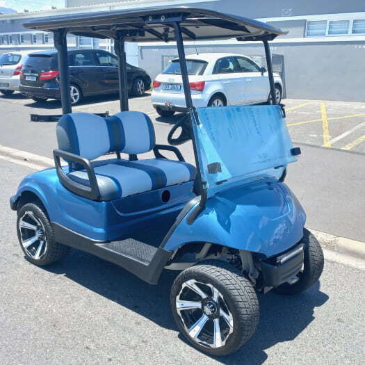 A fully refurbished golf cart on display outside the golf carts and all factory