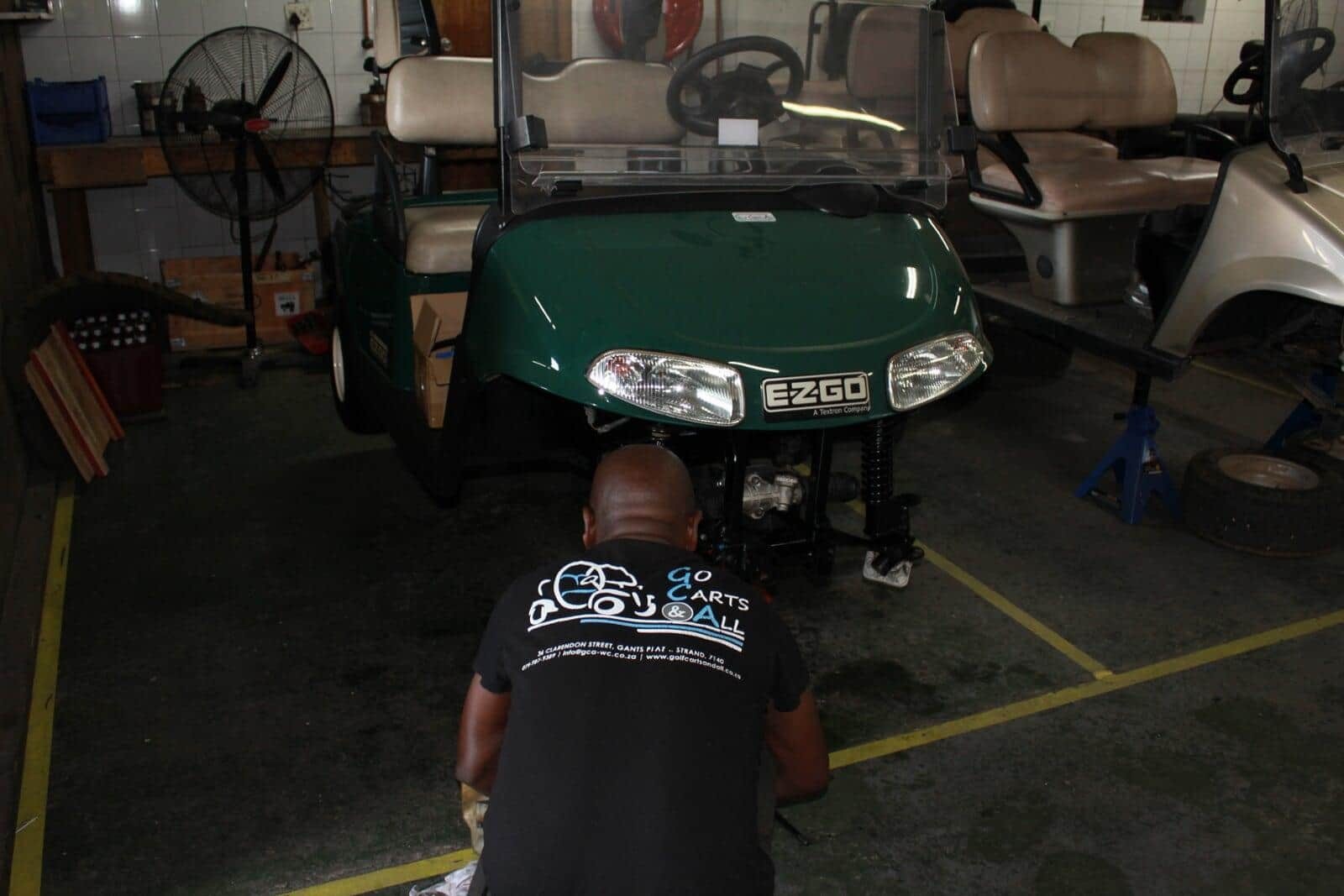 A Golf Carts & All Team member servicing an Ezgo golf cart