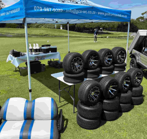 Golf cart and all displaying all their products during a golf day.