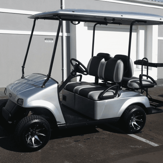 A newly converted golf cart upgraded from a 2-seater to a 4-seater, featuring a seamless finish and enhanced seating capacity