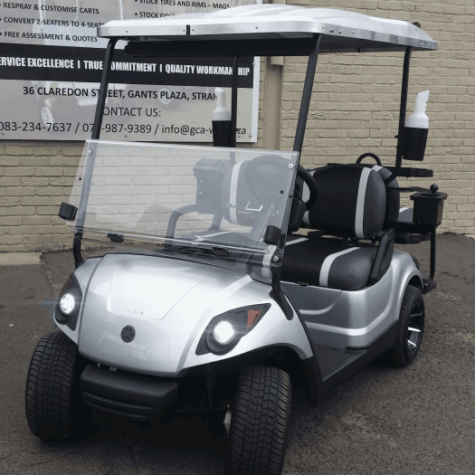 A golf cart, fully resprayed in sleek silver, featuring newly upholstered seating for a refreshed and modern look.