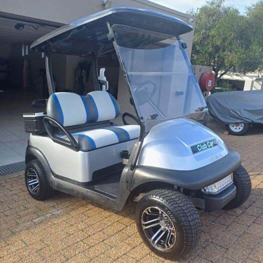 A golf cart fully refurbished for the customer being displayed at their home